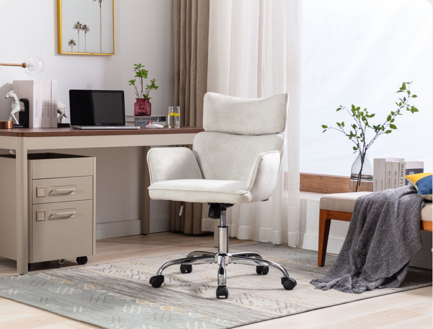 Home office desk setup with white chair